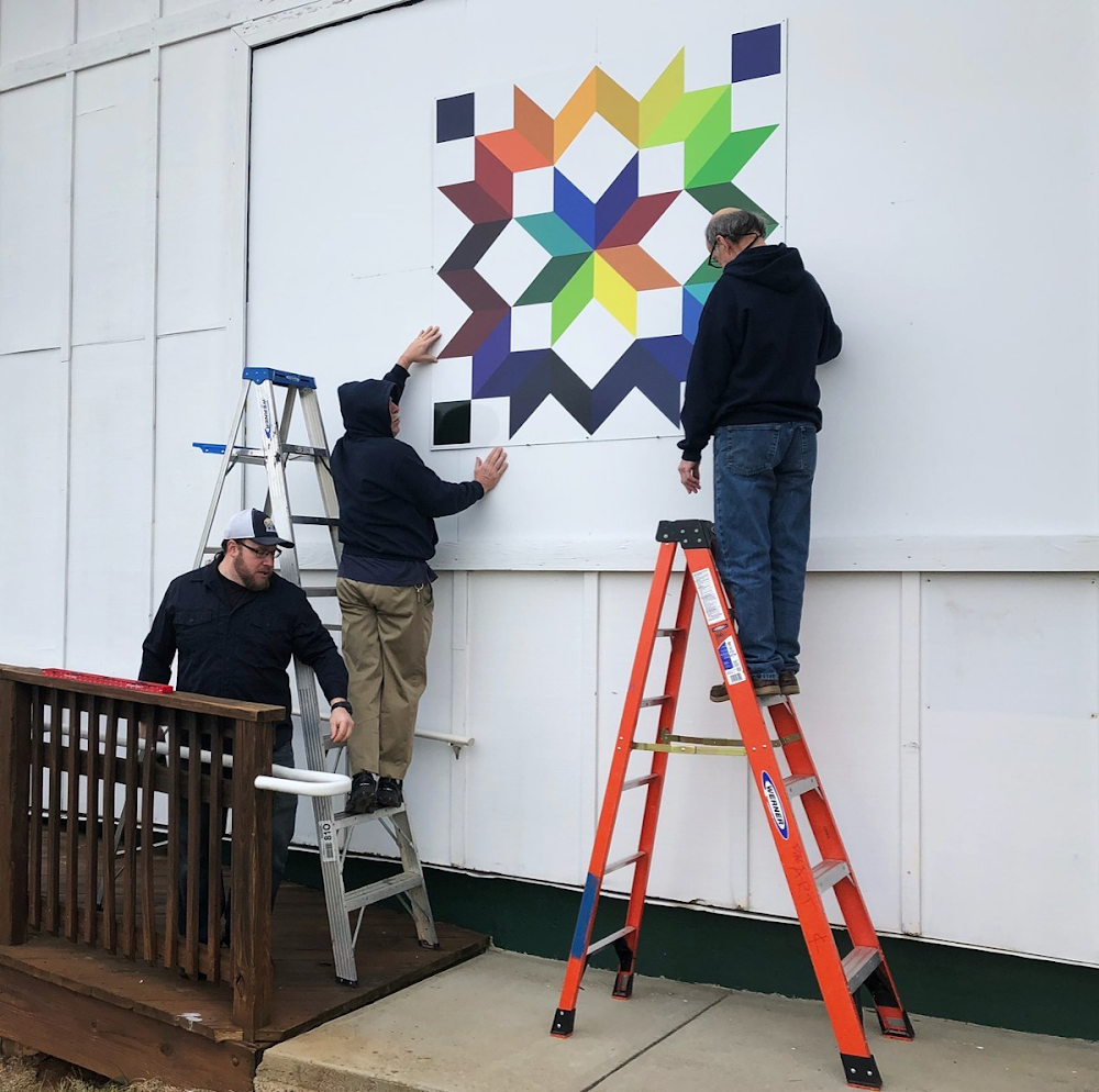 Installing the Carpenter's Wheel Quilt Square at Franklin Park Arts Center,